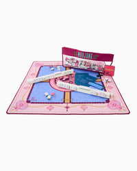 Decorative Mahjong mat with a central design of a horse and floral elements with game tiles on a pink and blue background.