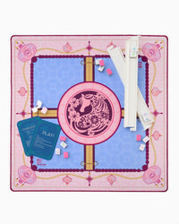 Decorative Mahjong mat with a central design of a horse and floral elements with game tiles and cards on a pink and blue background.
