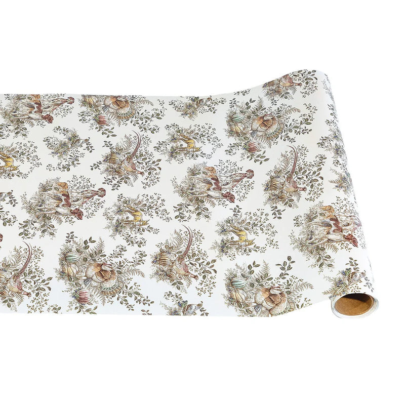 Roll of decorative paper with nature-themed design on a white background